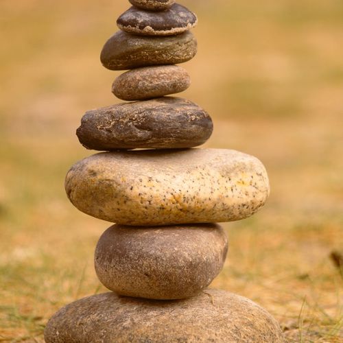 Symbol of balance and nature, like a stack of stones.